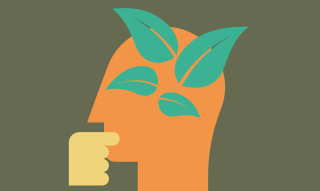 Het zijprofiel van een oranje gezicht met een hand onder de kin en vier groene blaadjes op het hoofd